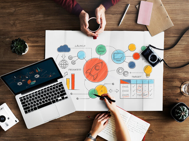 Small business startup planning desk with analytics tools