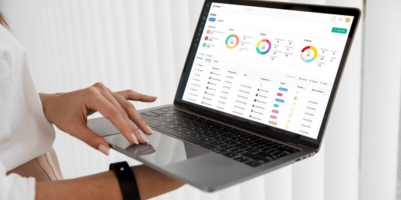 Marketing professional reviewing first-party data dashboard on laptop