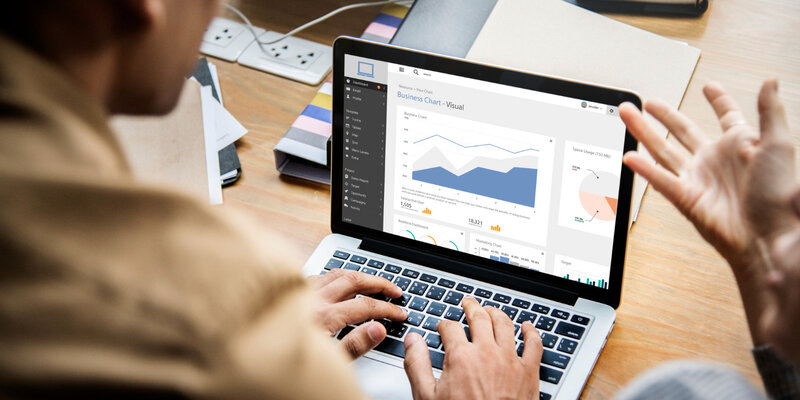 Marketing analyst reviewing conversion data on server-side tracking dashboard